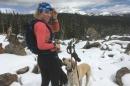 UNH student Georgi Fischer cross country skiing with her dog